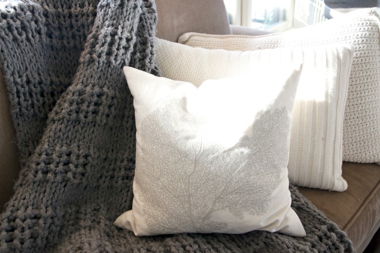 White pillows and blue throw