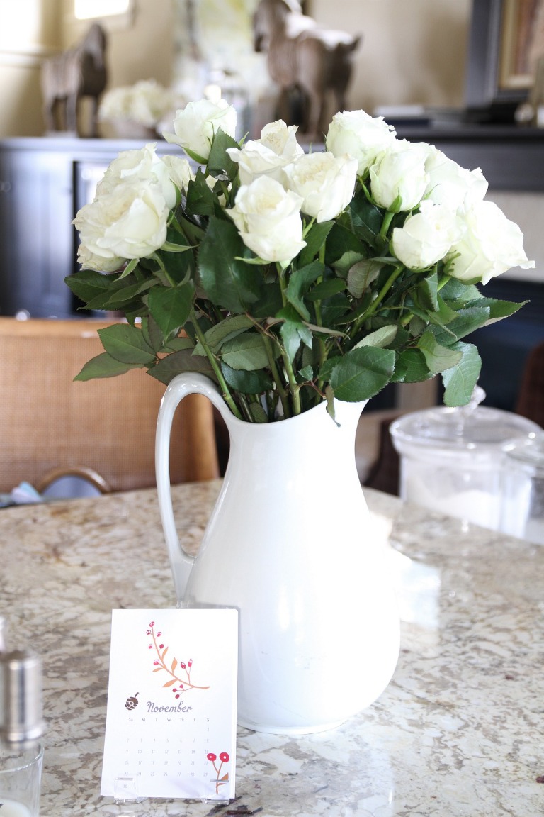 White roses in white jug